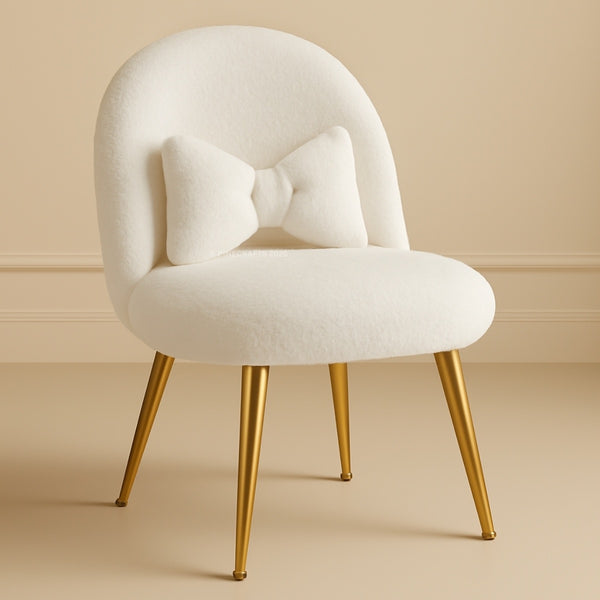 White chair with gold legs on a beige background