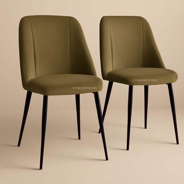 Two olive green chairs with black legs on a beige background