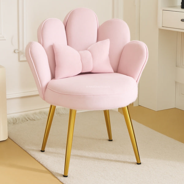 Pink chair with gold legs in a room setting