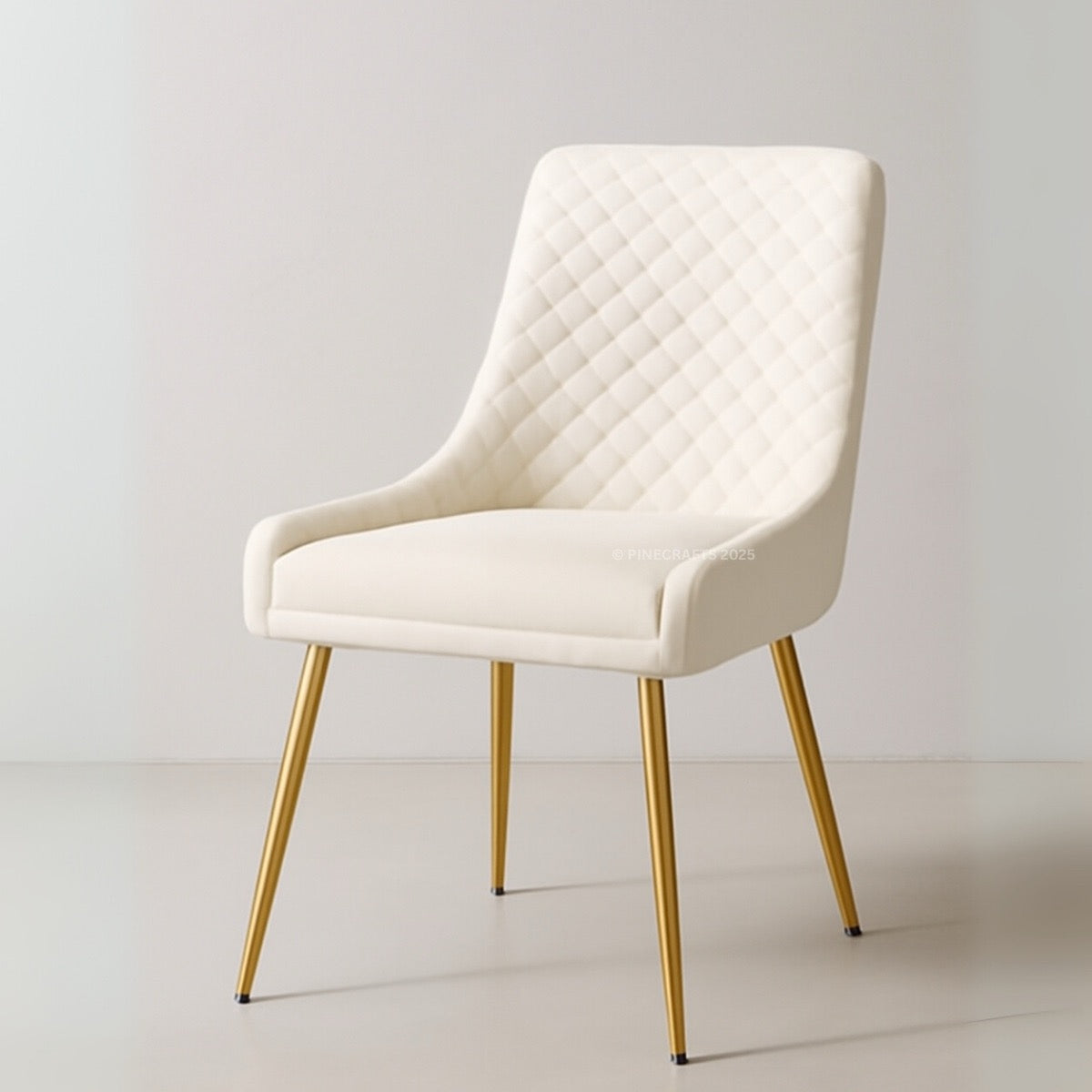 White upholstered chair with gold legs on a light gray background