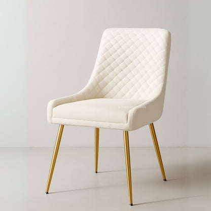 White upholstered chair with gold legs on a light gray background