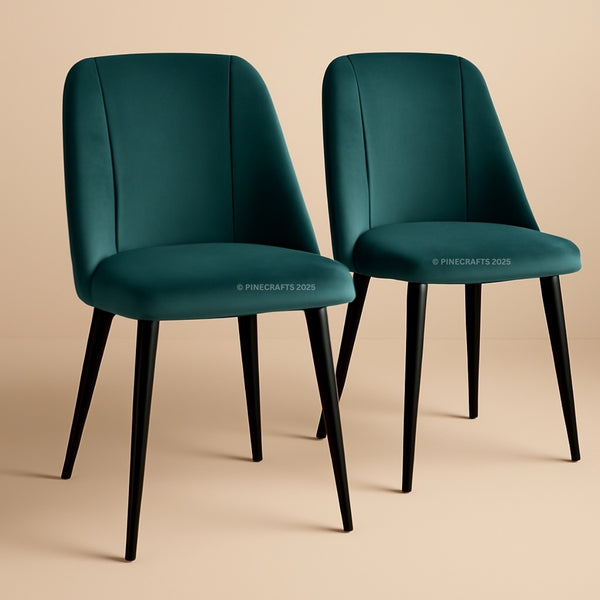 Two teal chairs with black legs on a beige background