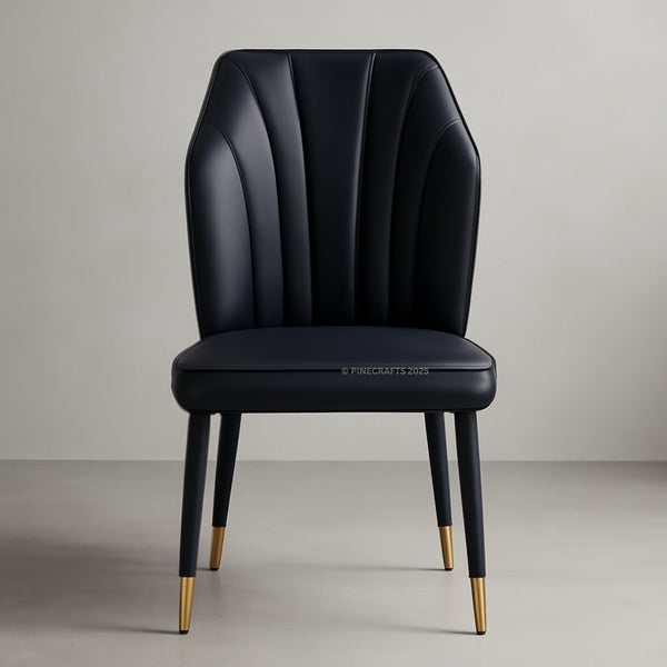 Black leather chair with gold accents on a gray background
