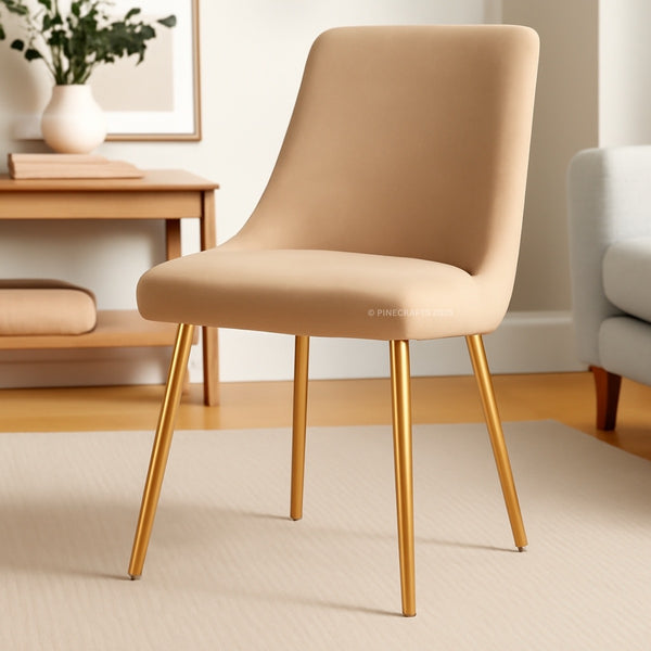 Beige chair with gold legs in a room setting