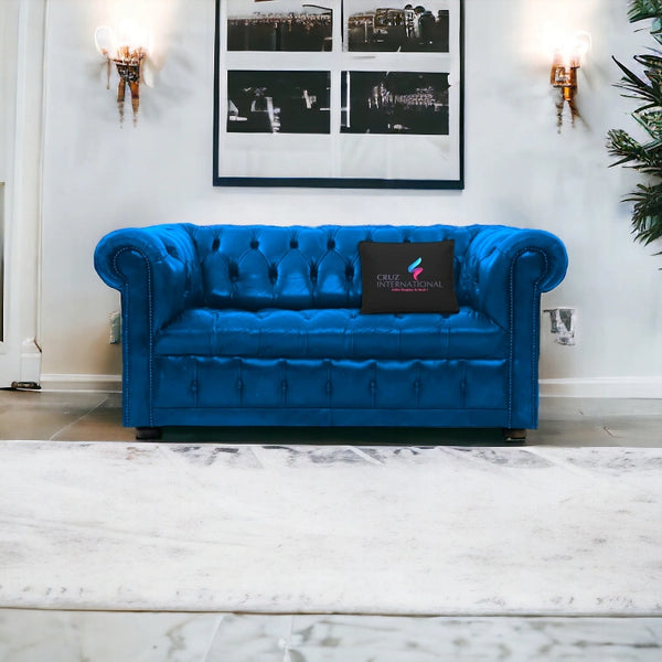 Blue tufted leather sofa in modern living room, CRUZ INTERNATIONAL furniture store pillow