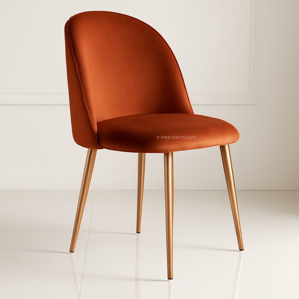 Orange chair with bronze legs on a white floor and light gray wall background
