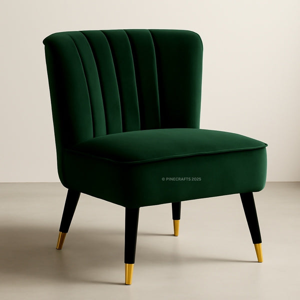 Green velvet chair with gold legs on a beige background