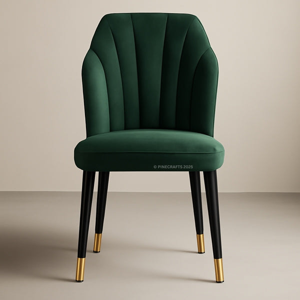 Green velvet chair with gold feet on a beige background