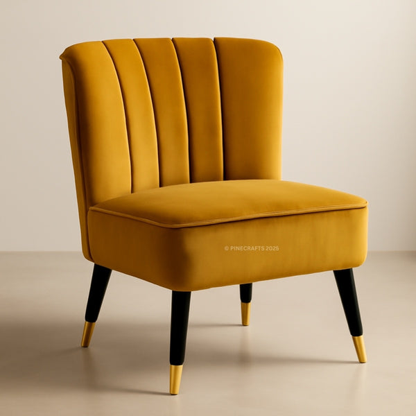 Mustard yellow chair with black legs and gold feet on a beige background