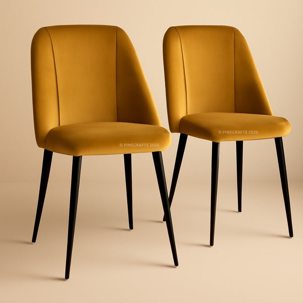 Two mustard yellow chairs with black legs on a beige background