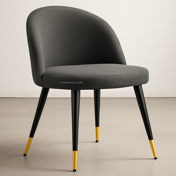 Gray chair with black legs and gold foot caps on a neutral background