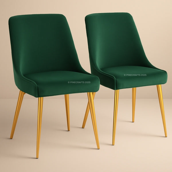 Two green chairs with gold legs on a beige background