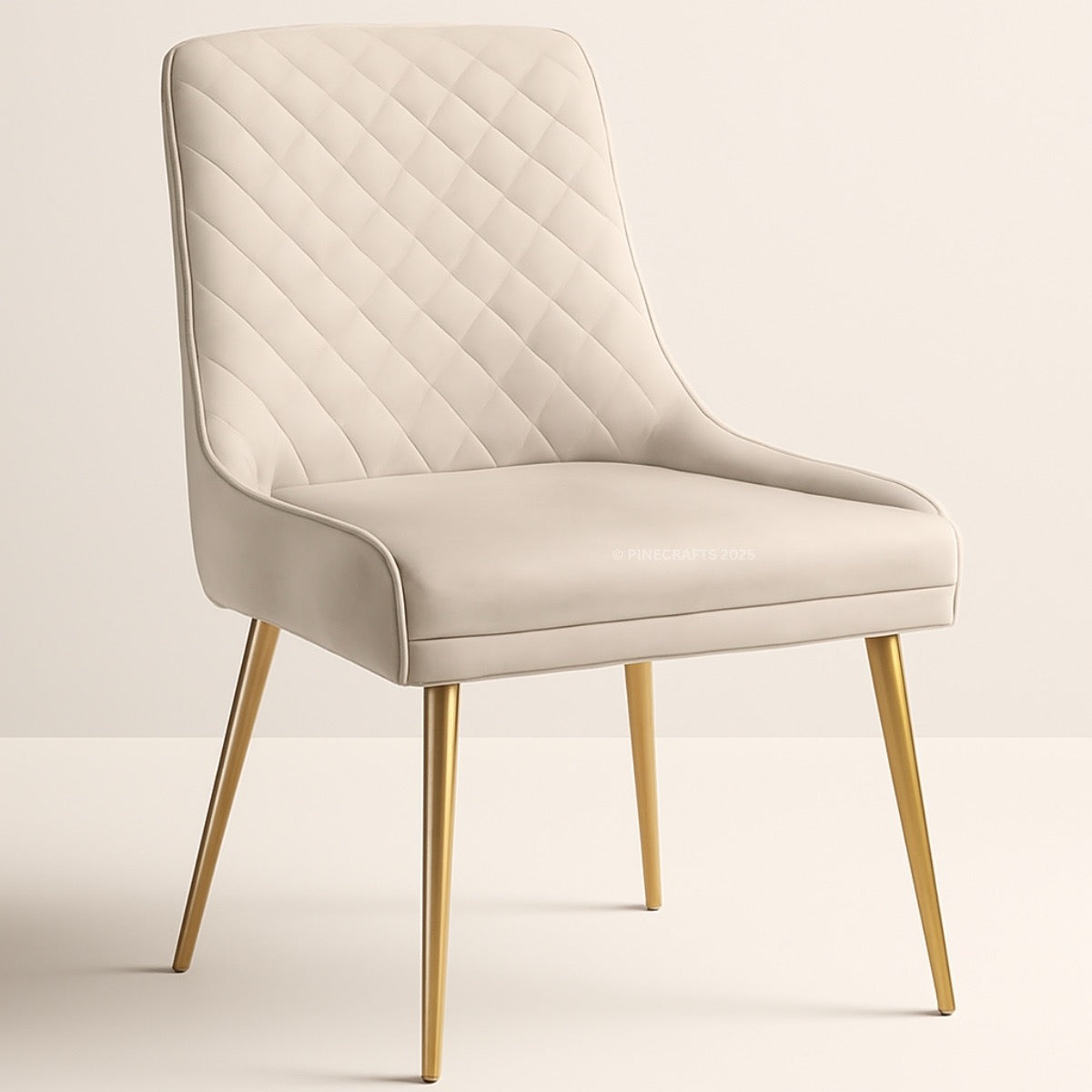 Beige upholstered chair with gold legs on a light beige background