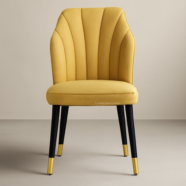 Yellow chair with black legs and gold tips on a beige background