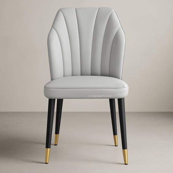 Gray upholstered chair with black legs and gold foot caps on a beige background