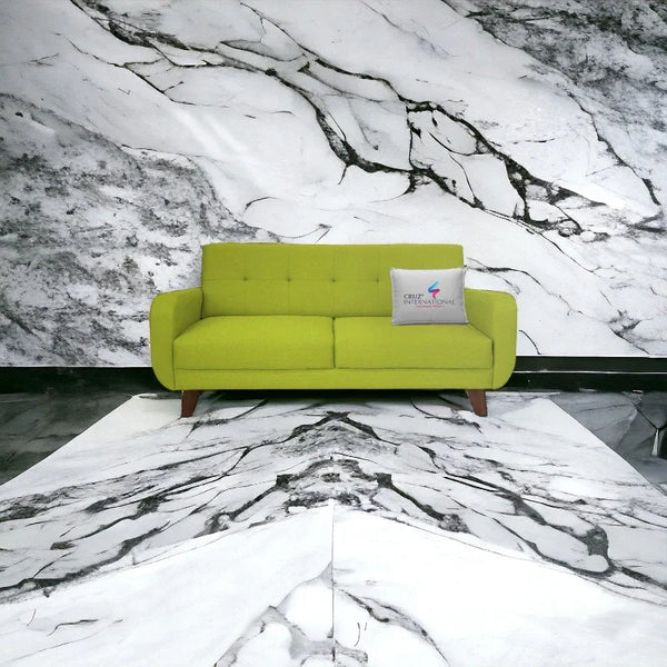 Modern light green sofa from CRUZ INTERNATIONAL on marble floor and wall, designer furniture.