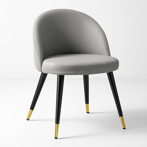 Gray chair with black legs and gold foot caps on a white background