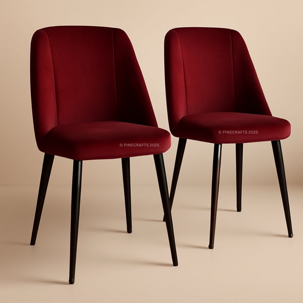 Two red chairs with black legs on a beige background
