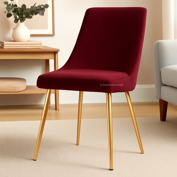 Red chair with gold legs in a room setting