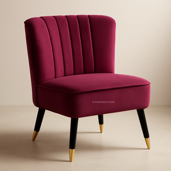 Magenta chair with black legs and gold feet on a beige background
