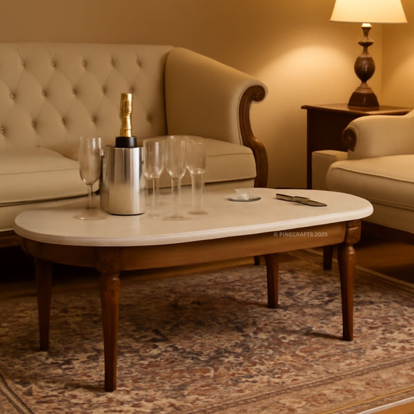 Living room with a coffee table, champagne bottle, and glasses.