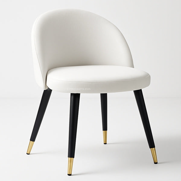 White chair with black legs and gold foot caps on a white background