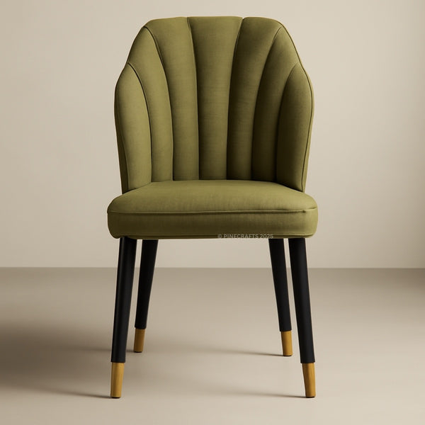 Green upholstered chair with black legs on a beige background
