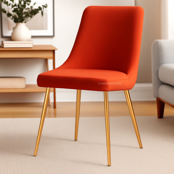 Orange chair with gold legs in a room setting