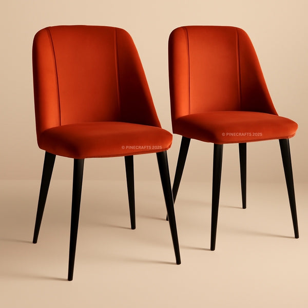 Two red chairs with black legs on a beige background