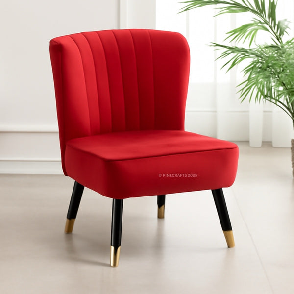 Red chair with black legs on a light wooden floor, brand 'PineCrafts' visible.