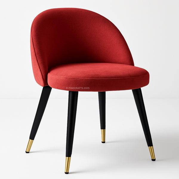 Red chair with black legs and gold foot caps on a white background