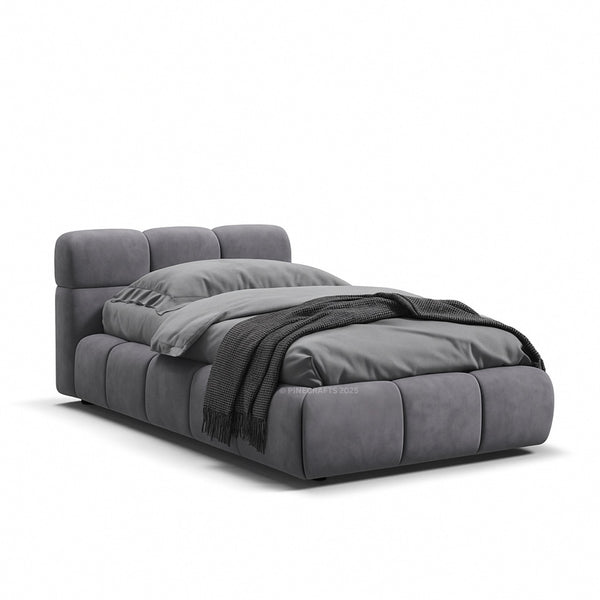 Gray upholstered bed with a blanket on a white background