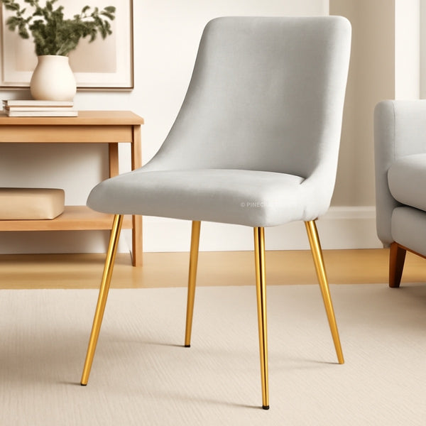 Gray chair with gold legs in a room setting