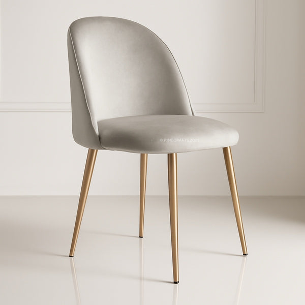 Modern chair with beige cushioned seat and gold legs on a white background