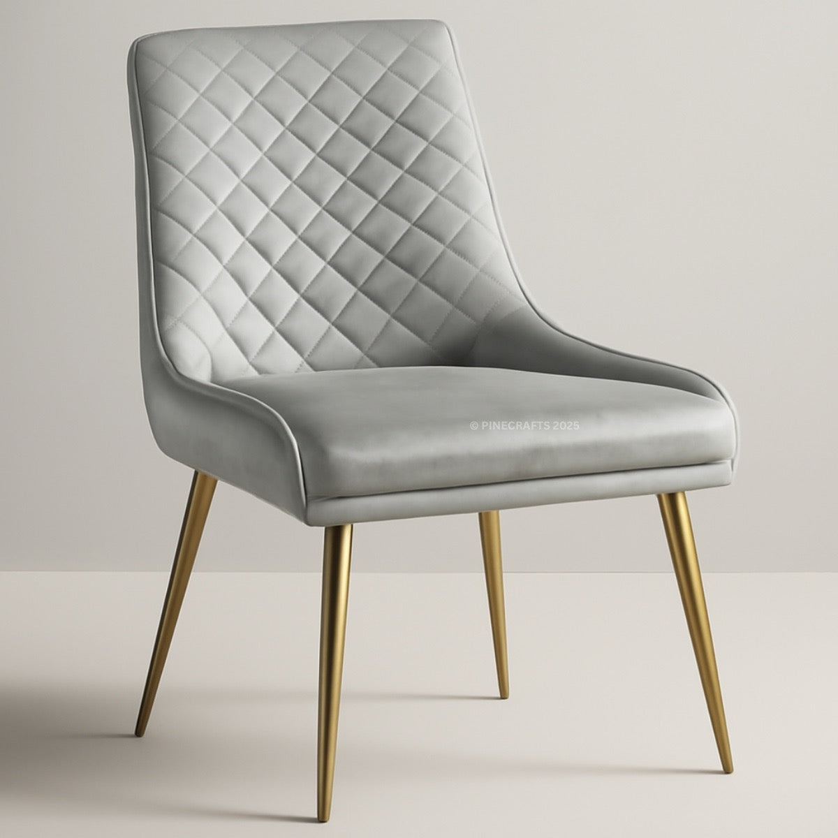 Gray quilted chair with gold legs on a light gray background