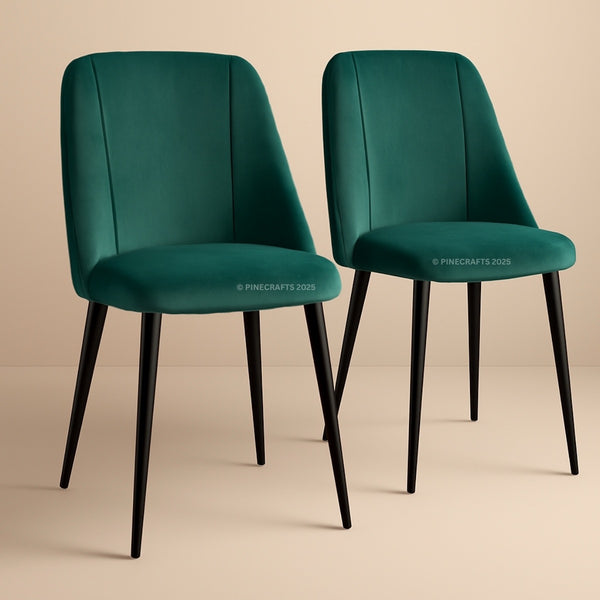 Two teal chairs with black legs on a beige background