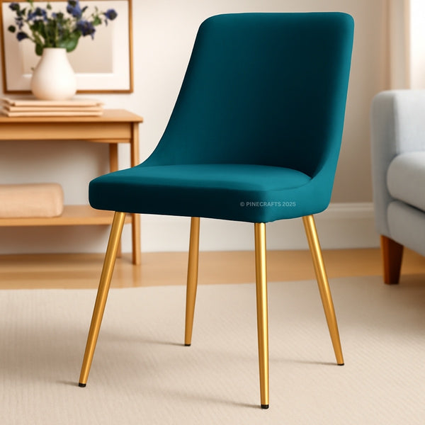 Teal chair with gold legs in a room setting