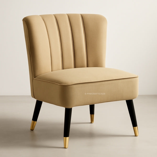 Beige armchair with black legs and gold feet on a neutral background